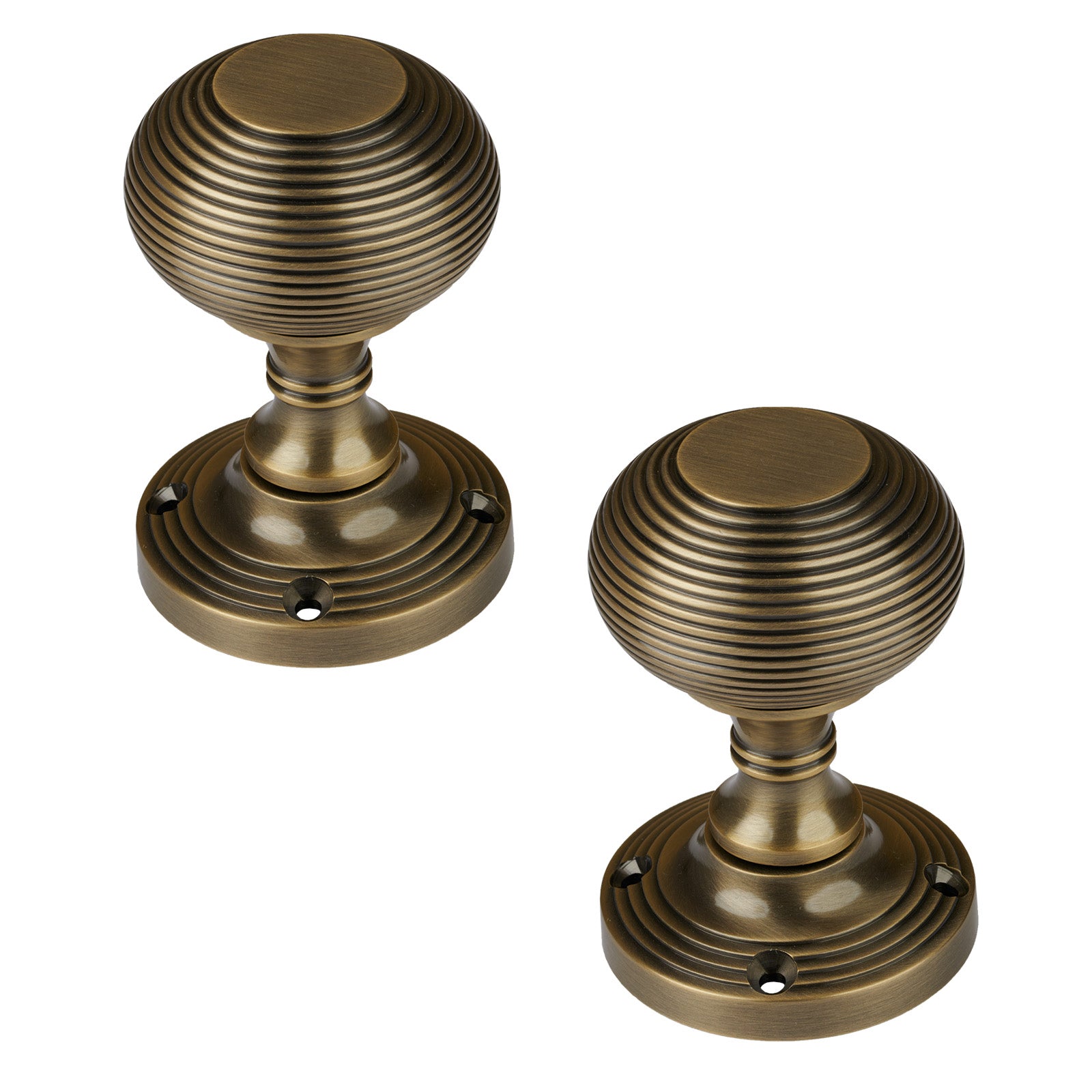 Reeded Door Knob on Rose in Aged Brass finish