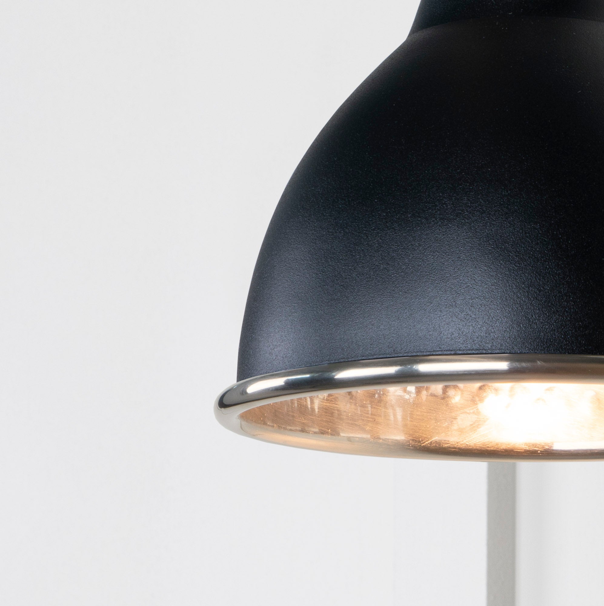 SHOW Close Up image of Brindley Wall Light in Elan Black in Hammered Nickel