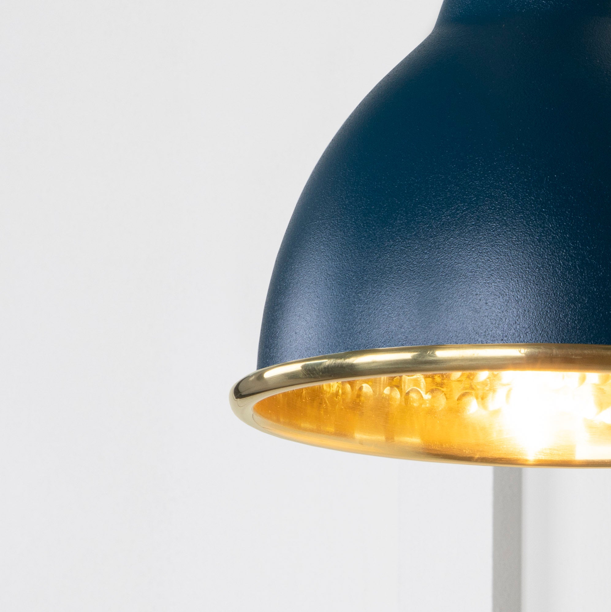 SHOW Close Up image of Brindley Wall Light in Dusk in Hammered Brass