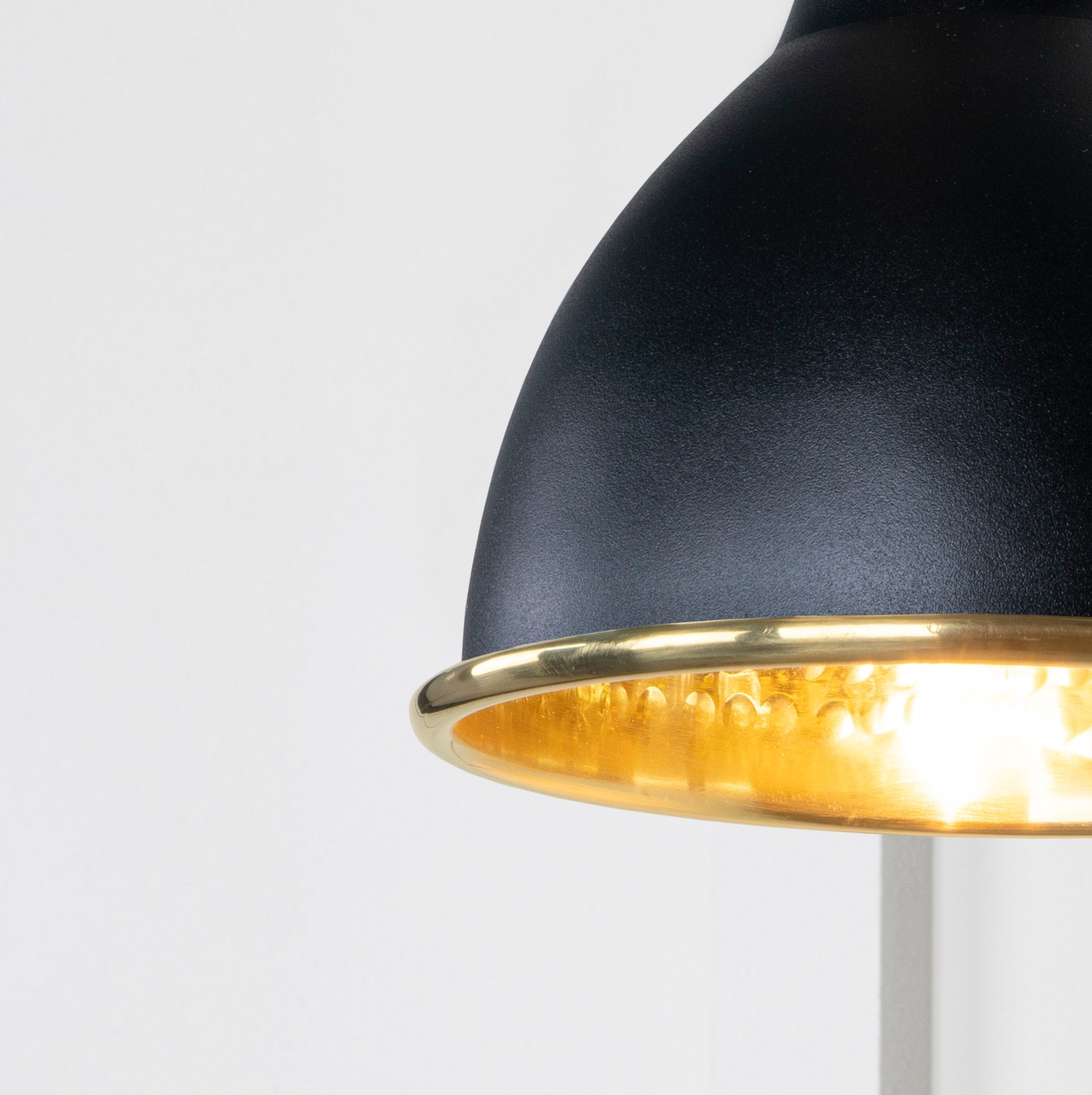 SHOW Close Up image of Brindley Wall Light in Elan Black in Hammered Brass