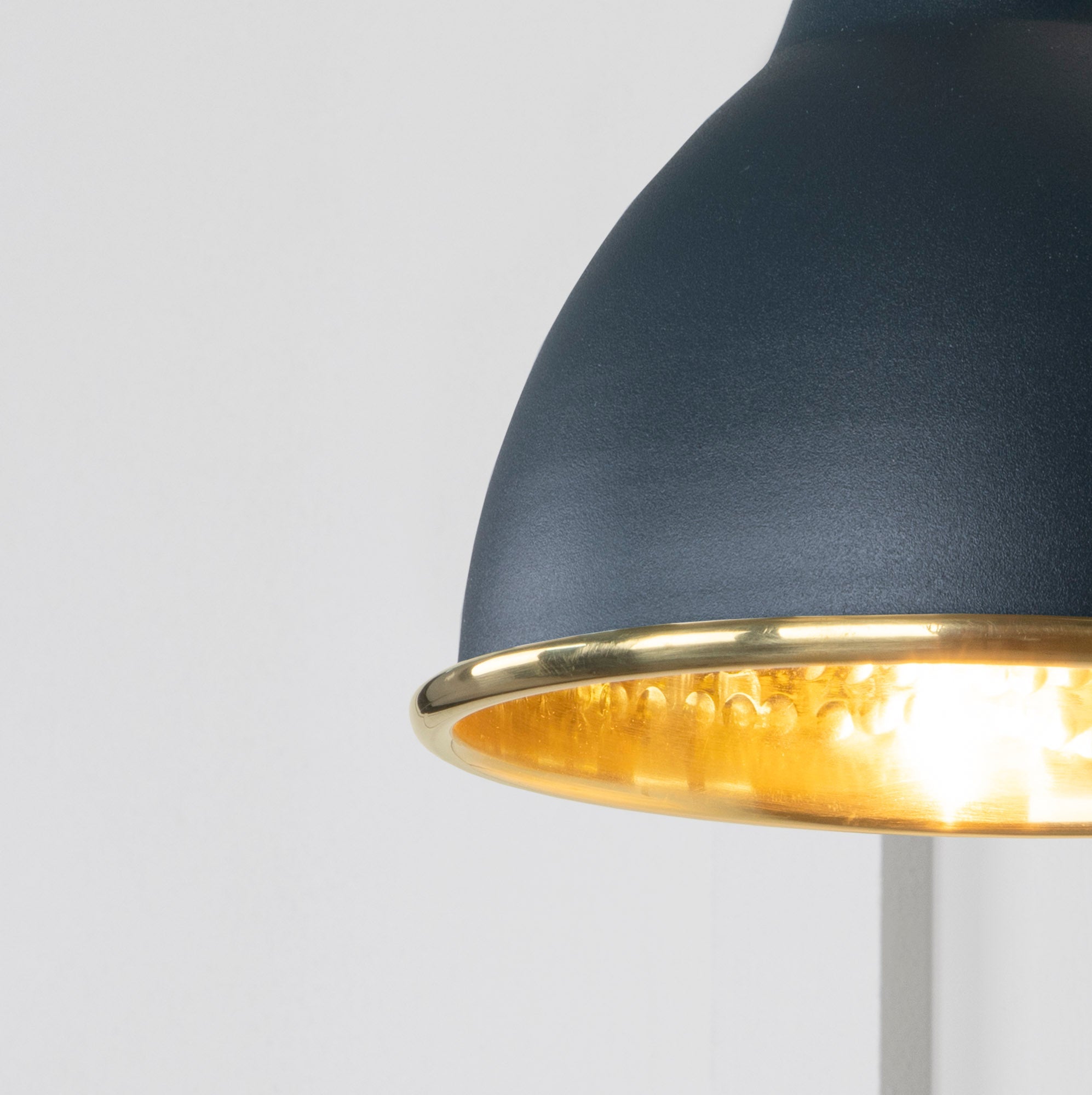 SHOW Close Up image of Brindley Wall Light in Soot in Hammered Brass