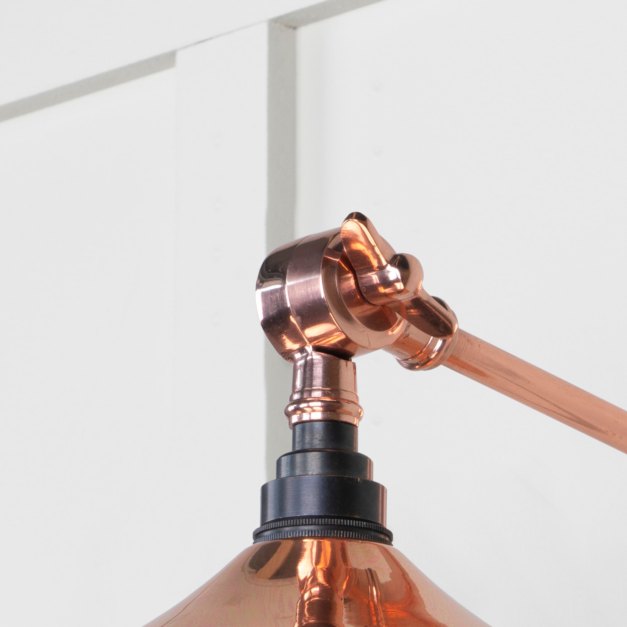 SHOW Close Up Image of Upper Hinge of Flora Wall Light in Copper