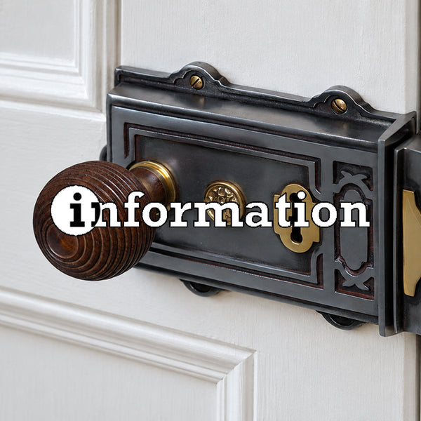 Rosewood concealed door knob on an old victorian rim lock