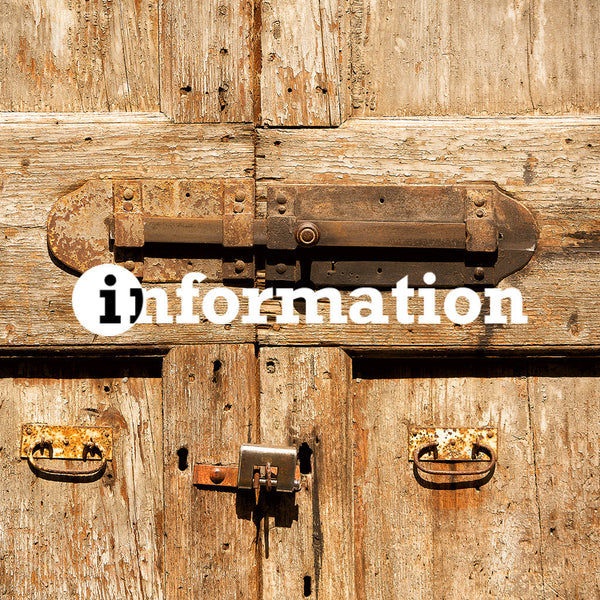 Old hand forged door bolt on door