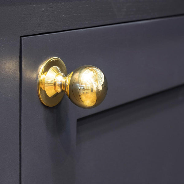 Round brass cabinet knob
