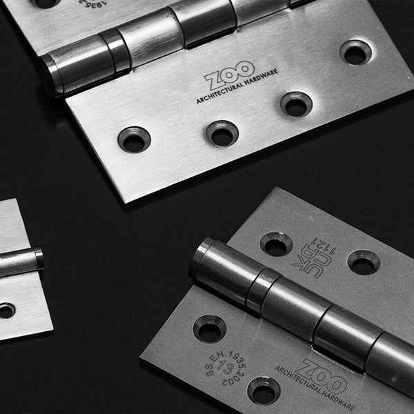 Fire rated hinges on black background