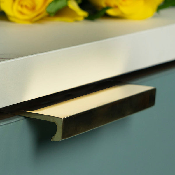 Brass edge pull fitted to drawer