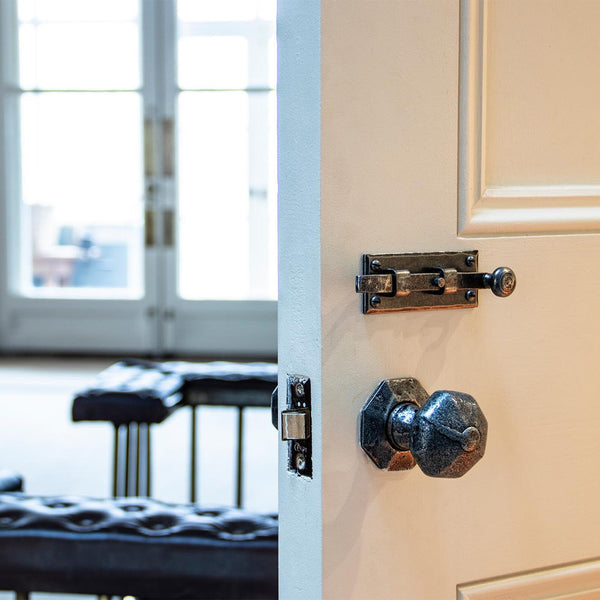 Door with pewter door knob and latch fitted