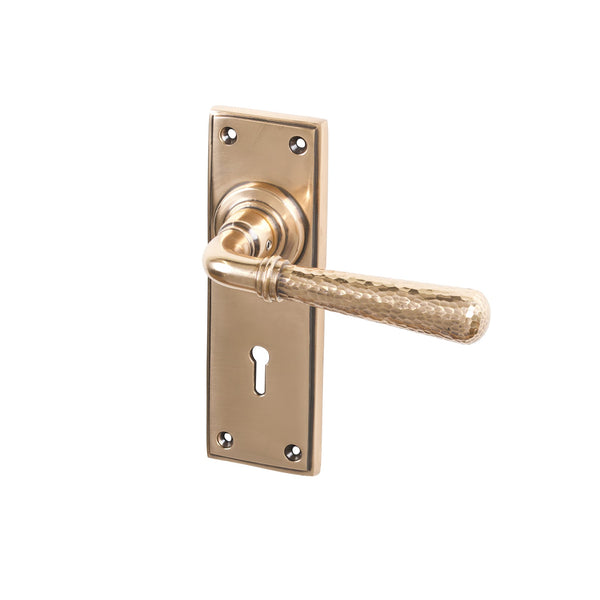 SHOW Polished Bronze Lock Hammered Newbury Lever Handles