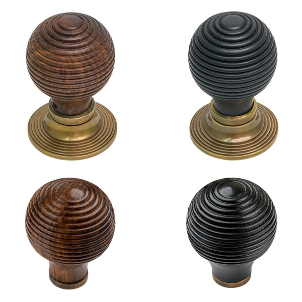 Four round door knobs arranged in a 2x2 grid on a white background, showing two dark brown wood finishes and two black finishes with brass bases.