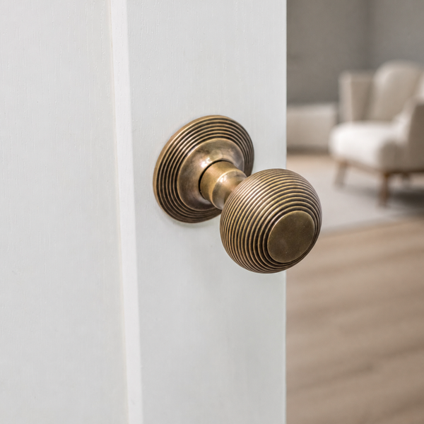  Antique Brass Beehive Door knob on white door