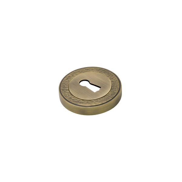  Image of Hammered BSU Escutcheon in Antique Brass finish
