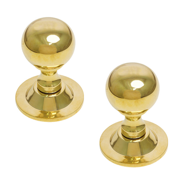  Two polished brass door knobs with spherical tops and round flanged bases, shown on a plain white background.