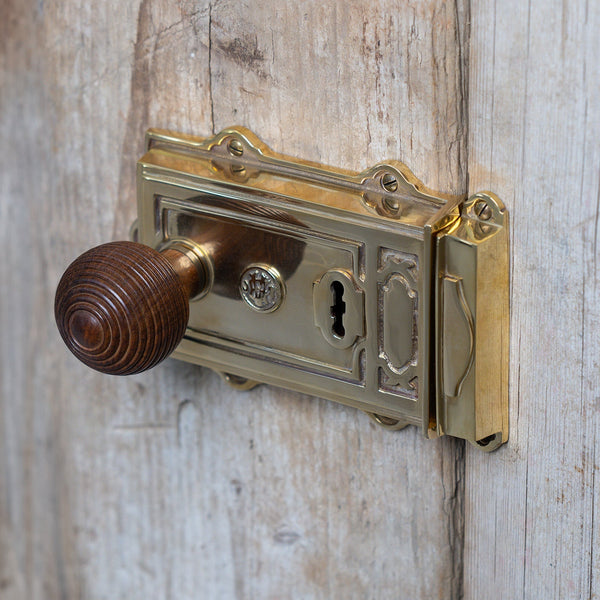  Lifestyle image of Ornate Brass Rim Lock on wood