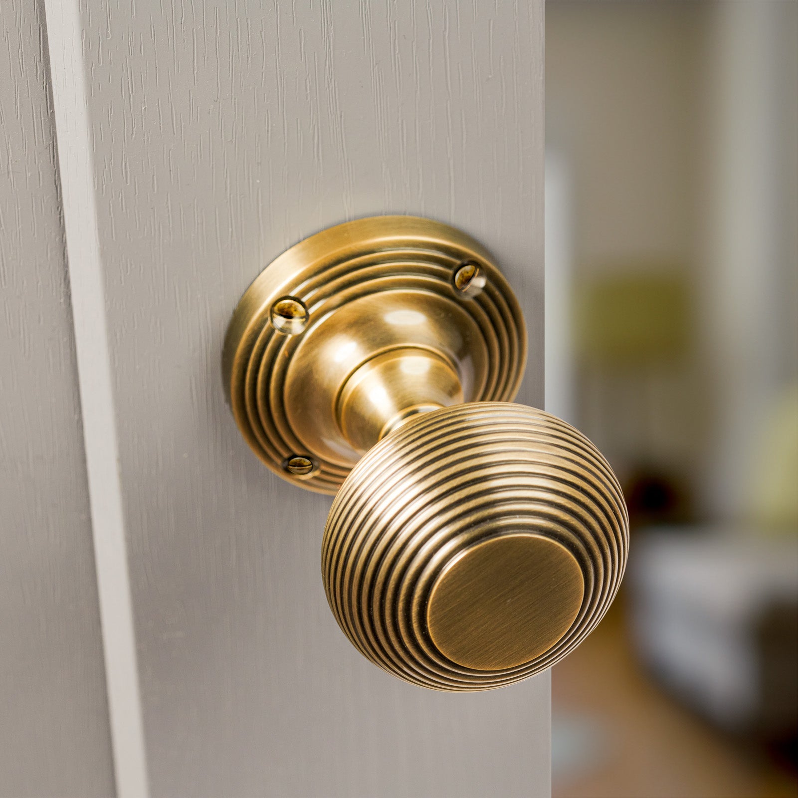 SHOW Moody Image of Reeded Door Knob on Rose