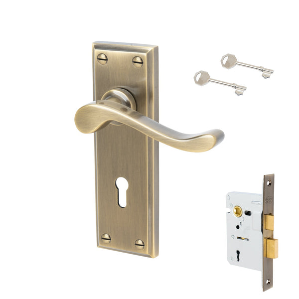 Edwardian Door Handles On Plate Lock Handle Set in Aged Brass