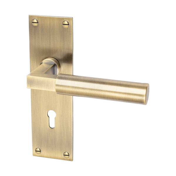 Bauhaus Door Handles On Plate Lock Handle in Aged Brass