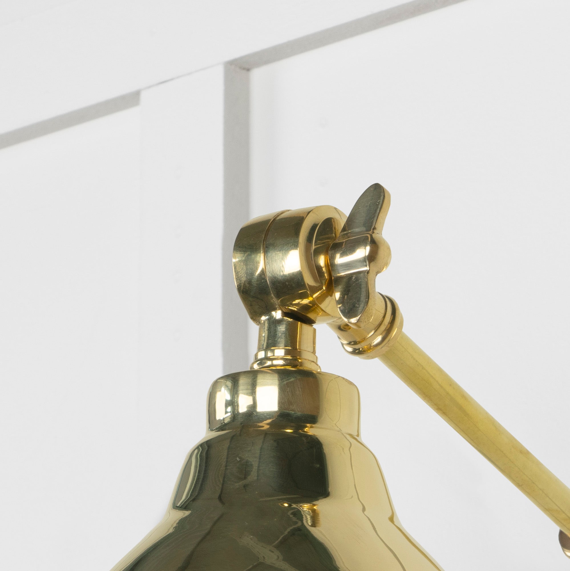 SHOW Close up Image of hinge for Brindley Wall Light in Brass