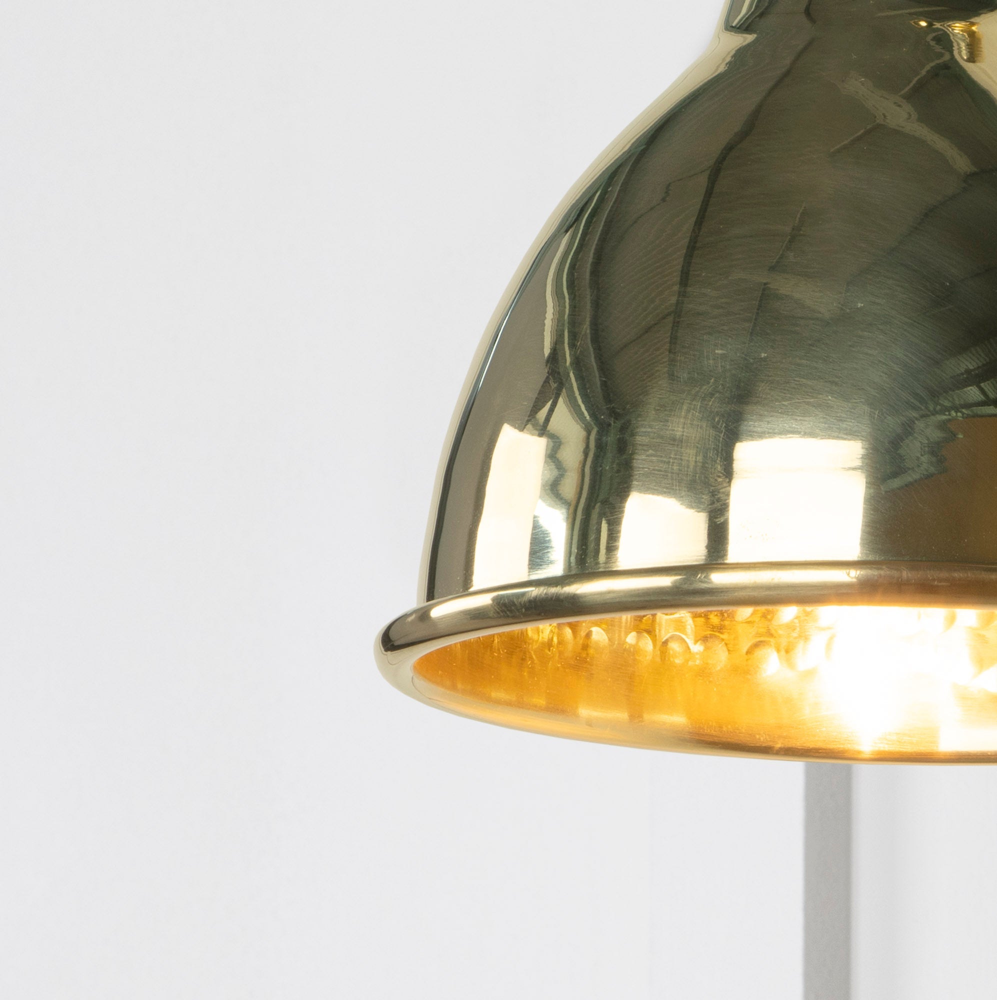 SHOW Close up Image of Brindley Wall Light in Hammered Brass
