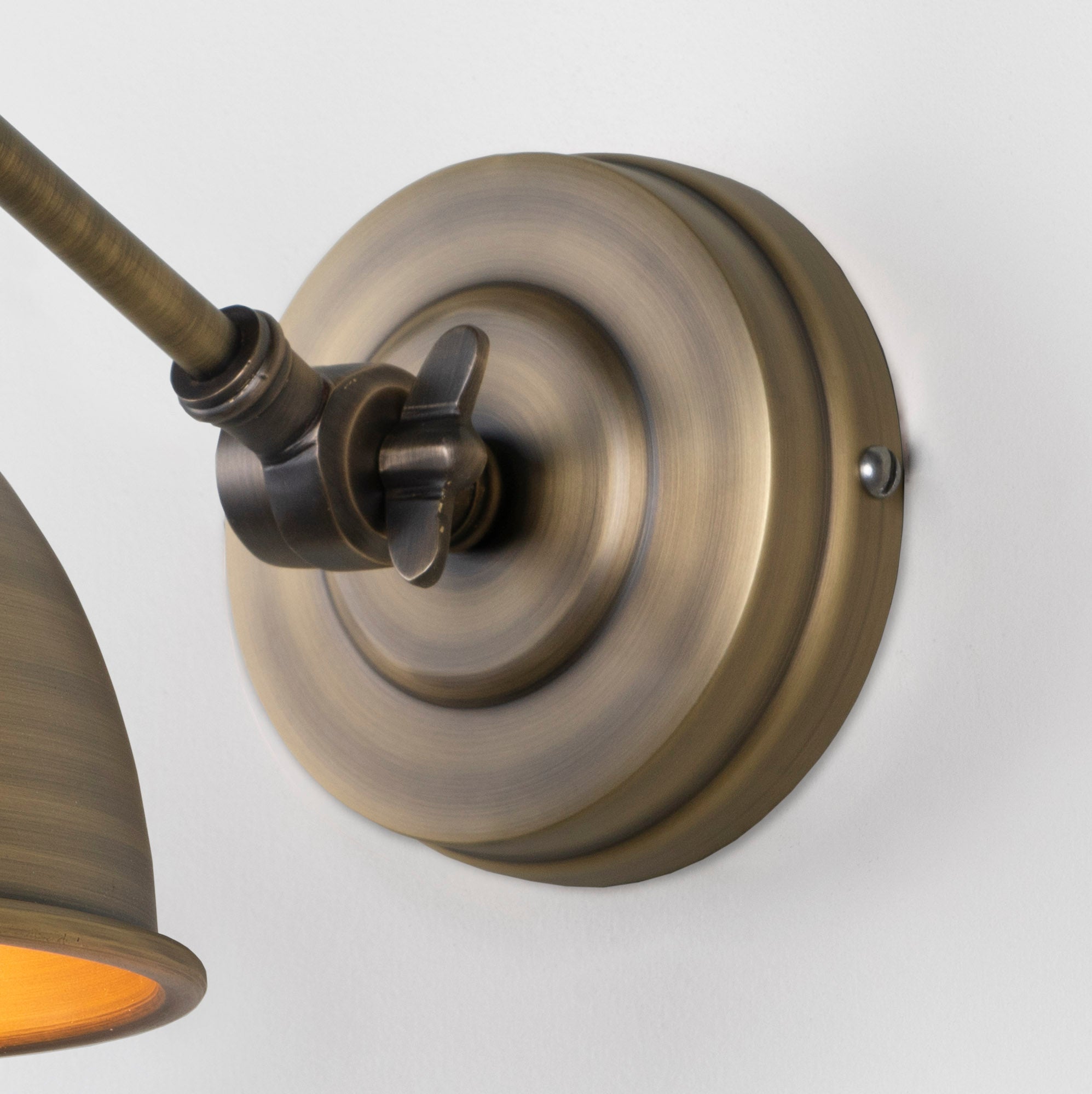 SHOW Close up Image of wall rose for Brindley Wall Light in Aged Brass