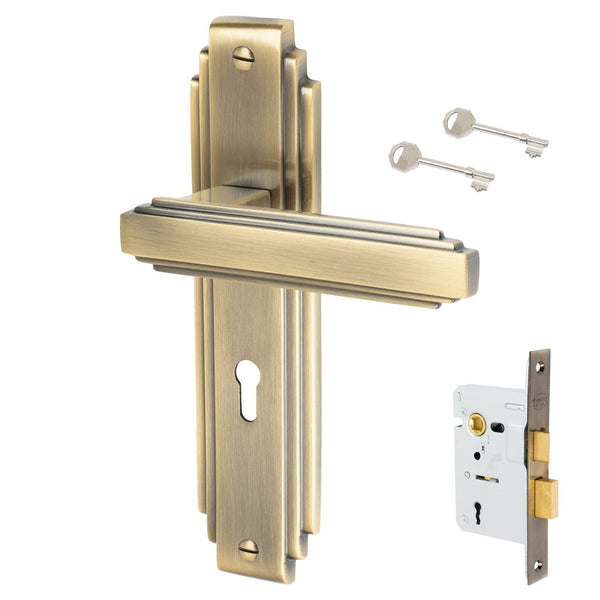 Astoria Door Handles On Plate Lock Handle Set in Aged Brass