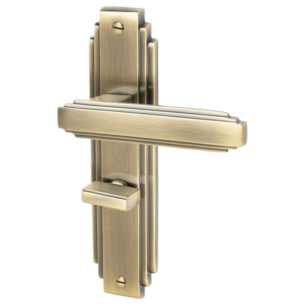 Astoria Door Handles On Plate Bathroom Handle in Aged Brass