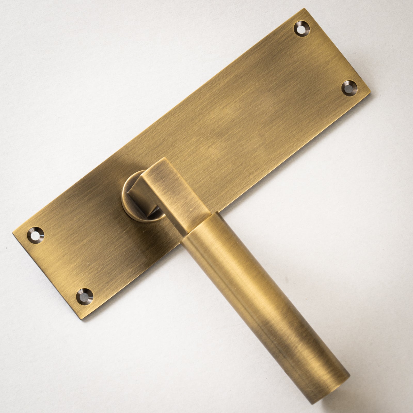Bauhaus Door Handles On Plate Latch Handle in Aged Brass SHOW
