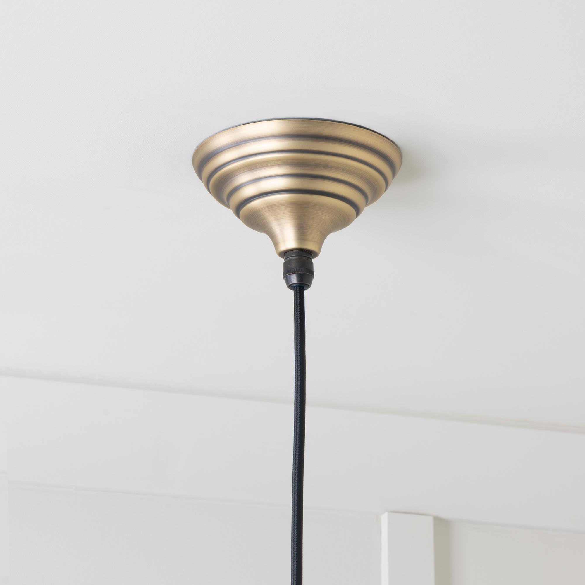 SHOW Close Up Image of Brindley Ceiling Light in Aged Brass