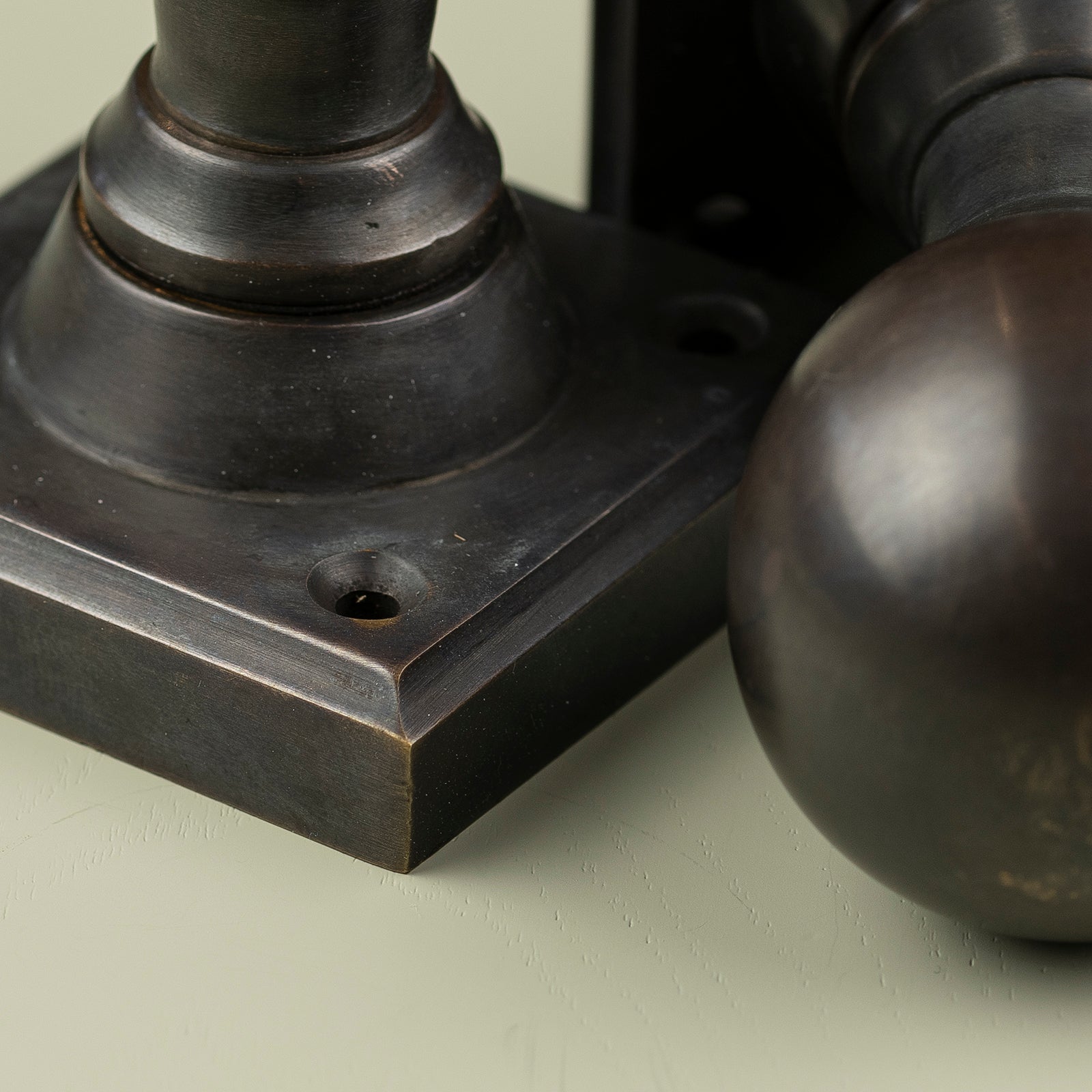 Detail of round bronze door knob SHOW