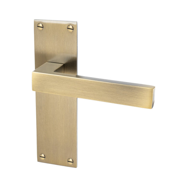 Metro Door Handles On Plate Latch Handle in Aged Brass 