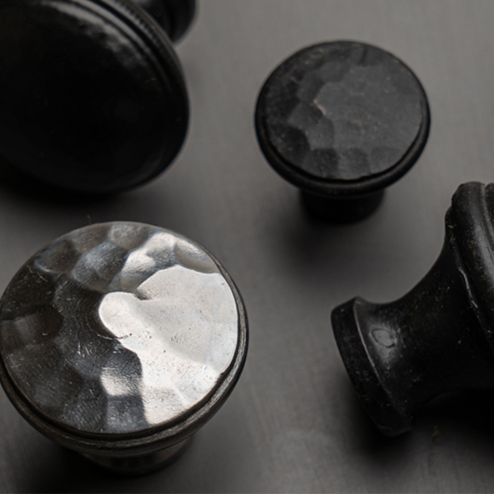 hand beaten cupboard knobs in black and pewter SHOW